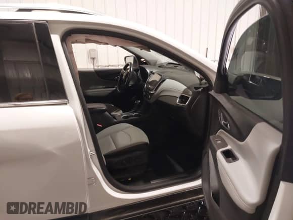 2018 Chevrolet Equinox Premier z VIN 2GNAXVEV6J6303124, wystawiony jako IAAI lot #43150684 z przebiegiem 91 946 mil mil oraz . Historia ofert i sprzedaży dostępna na DreamBid. Obrazek 5.