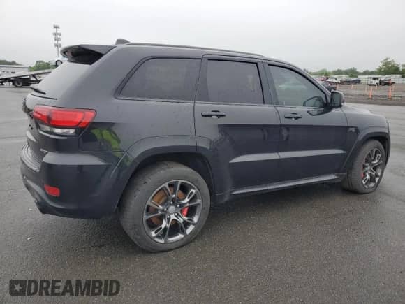 2016 Jeep Grand Cherokee SRT z VIN 1C4RJFDJXGC343157, wystawiony jako Copart lot #59521275 z przebiegiem Nie podano mil oraz Szkoda całkowita • Salvage title. Historia ofert i sprzedaży dostępna na DreamBid. Obrazek 3.