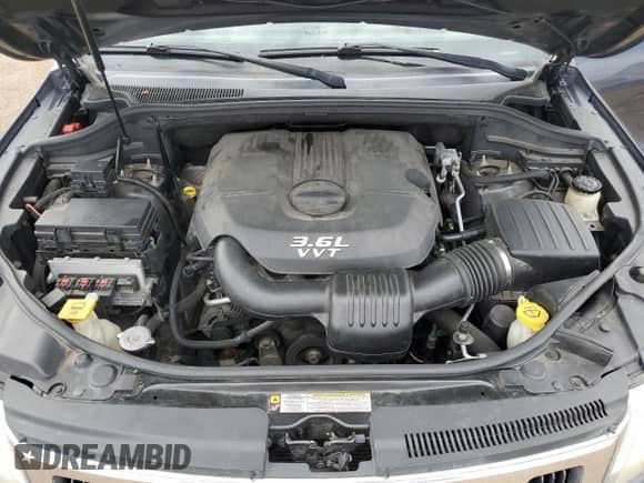 2012 Jeep Grand Cherokee Laredo z VIN 1C4RJFAG5CC202791, wystawiony jako Copart lot #86040175 z przebiegiem 206 265 mil mil oraz Szkoda całkowita • Salvage title. Historia ofert i sprzedaży dostępna na DreamBid. Obrazek 12.