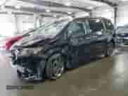 2014 Toyota Sienna SE with VIN 5TDXK3DC7ES482016, listed as a Copart auction lot 69857475 with 136,304 mi miles and Salvage title. Bid and sale history available at DreamBid. Image 1.