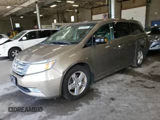 2011 Honda Odyssey Touring с VIN 5FNRL5H98BB058103, выставлен на аукционе Copart как лот 65178365 с пробегом 217 870 миль миль и Списание • Salvage title. История ставок и продаж доступна на DreamBid. Изображение 1.