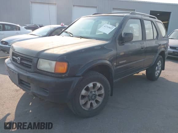 1998 Honda Passport LX with VIN 4S6CM58WXW4403219, listed as a IAAI auction lot 42715922 with 153,181 mi miles and . Bid and sale history available at DreamBid. Image 2.