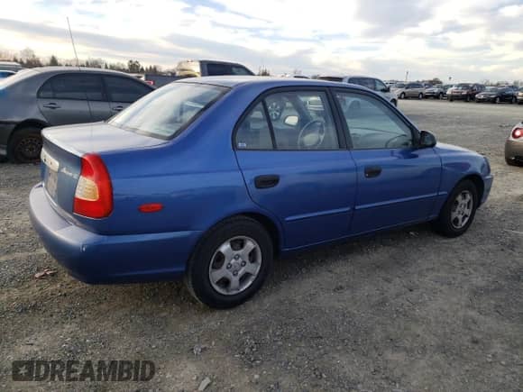 2000 Hyundai Accent z VIN KMHCG45GXYU125691, wystawiony jako Copart lot #87253294 z przebiegiem 91 062 mil mil oraz Szkoda całkowita • Salvage title. Historia ofert i sprzedaży dostępna na DreamBid. Obrazek 3.