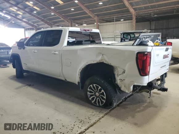 2023 GMC Sierra 1500 AT4 with VIN 3GTUUEE84PG109553, listed as a Copart auction lot 69766895 with 76,884 mi miles and Salvage title. Bid and sale history available at DreamBid. Image 2.