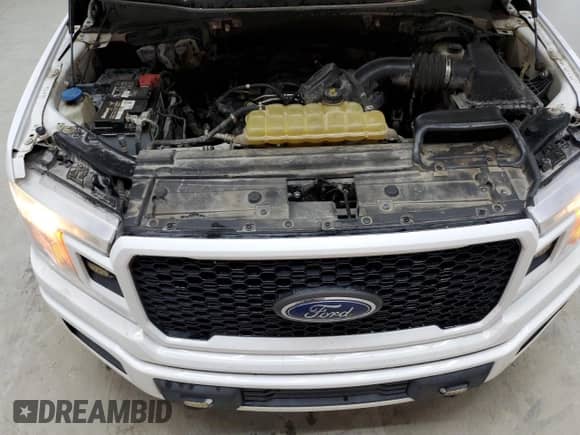 2020 Ford F-150 XL z VIN 1FTFX1E59LKD41602, wystawiony jako Copart lot #72016735 z przebiegiem 128 089 mil mil oraz Czysty tytuł • Clean title. Historia ofert i sprzedaży dostępna na DreamBid. Obrazek 11.