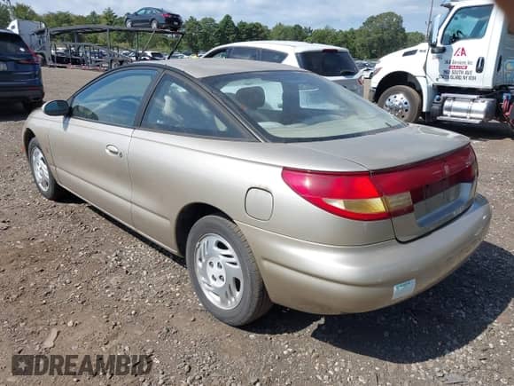 1999 Saturn SC with VIN 1G8ZH1277XZ127585, listed as a IAAI auction lot 43275573 with 96,289 mi miles and . Bid and sale history available at DreamBid. Image 3.