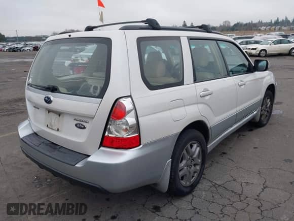 2007 Subaru Forester X L.L. Bean with VIN JF1SG67617H715811, listed as a IAAI auction lot 41332386 with 106,361 mi miles and . Bid and sale history available at DreamBid. Image 4.