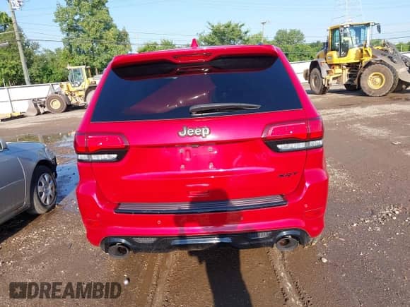 2021 Jeep Grand Cherokee SRT with VIN 1C4RJFDJ1MC818352, listed as a IAAI auction lot 42937368 with 37,574 mi miles and . Bid and sale history available at DreamBid. Image 17.