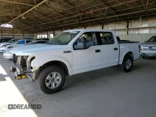 2020 Ford F-150 XL with VIN 1FTEW1C45LKD11814, listed as a Copart auction lot 69002595 with 106,500 mi miles and Salvage title. Bid and sale history available at DreamBid. Image 1.