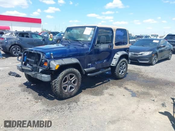 2001 Jeep Wrangler SE with VIN 1J4FA29P01P344644, listed as a IAAI auction lot 42170936 with 130,938 mi miles and . Bid and sale history available at DreamBid. Image 2.