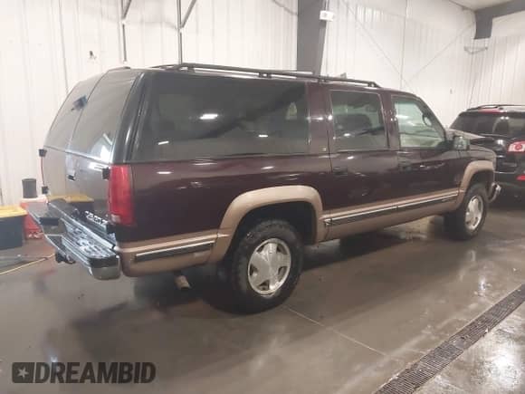 1996 Chevrolet Suburban with VIN 1GNFK16R3TJ384720, listed as a IAAI auction lot 42348673 with 143,831 mi miles and . Bid and sale history available at DreamBid. Image 4.