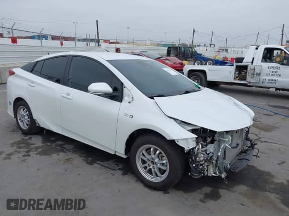 2021 Toyota Prius XLE with VIN JTDKAMFP6M3194992, listed as a IAAI auction lot 43311948 with 96,751 mi miles and . Bid and sale history available at DreamBid. Image 1.