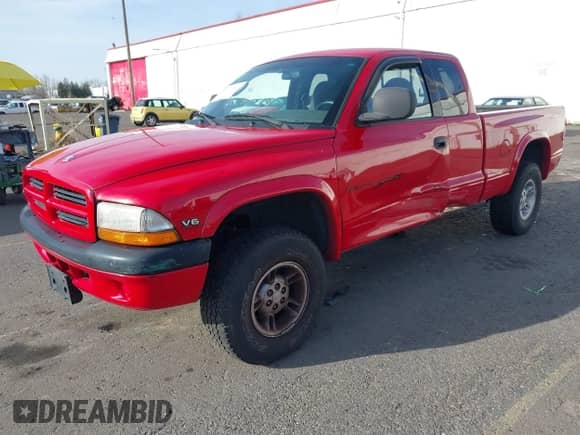 1999 Dodge Dakota SLT with VIN 1B7GG22XXXS290116, listed as a IAAI auction lot 41372636 with 132,112 mi miles and . Bid and sale history available at DreamBid. Image 2.