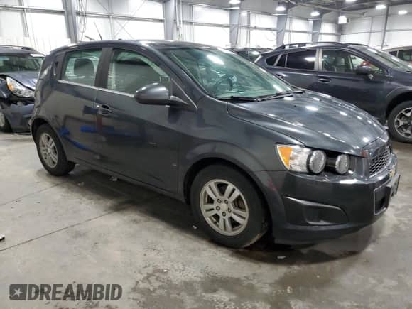 2014 Chevrolet Sonic LT with VIN 1G1JC6SB7E4174069, listed as a Copart auction lot 61575665 with 98,204 mi miles and Salvage title. Bid and sale history available at DreamBid. Image 4.
