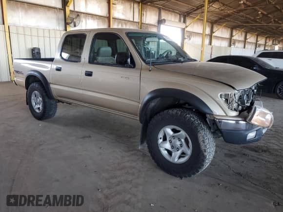2001 Toyota Tacoma PreRunner z VIN 5TEGN92N71Z859665, wystawiony jako Copart lot #84799325 z przebiegiem 202 008 mil mil oraz Szkoda całkowita • Salvage title. Historia ofert i sprzedaży dostępna na DreamBid. Obrazek 4.