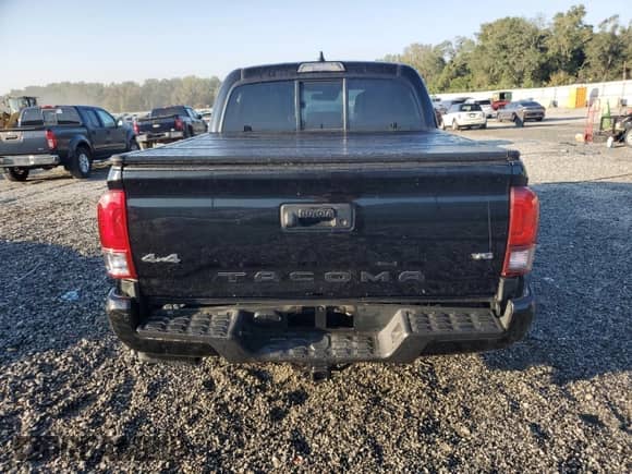 2023 Toyota Tacoma SR с VIN 3TMCZ5AN1PM589920, выставлен на аукционе Copart как лот 81328205 с пробегом 67 306 миль миль и Списание • Salvage title. История ставок и продаж доступна на DreamBid. Изображение 6.