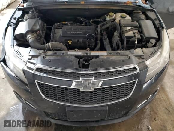 2014 Chevrolet Cruze 1LT z VIN 1G1PC5SBXE7295634, wystawiony jako Copart lot #82329965 z przebiegiem 139 795 mil mil oraz Szkoda całkowita • Salvage title. Historia ofert i sprzedaży dostępna na DreamBid. Obrazek 11.