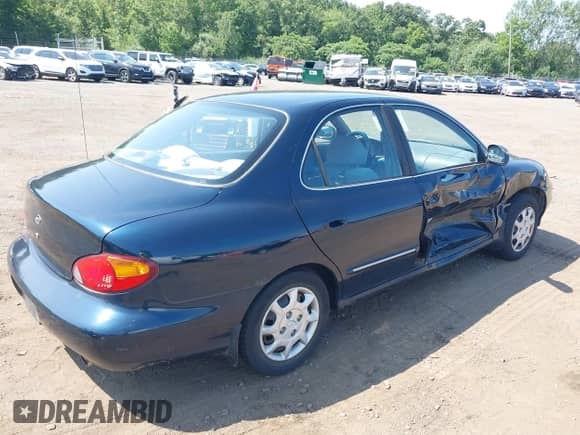 2000 Hyundai Elantra GLS z VIN KMHJF35F4YU967843, wystawiony jako IAAI lot #42817274 z przebiegiem 85 044 mil mil oraz . Historia ofert i sprzedaży dostępna na DreamBid. Obrazek 17.