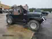 2002 Jeep Wrangler Sahara with VIN 1J4FA59SX2P747327, listed as a Copart auction lot 59515455 with 79,964 mi miles and Salvage title. Bid and sale history available at DreamBid. Image 4.