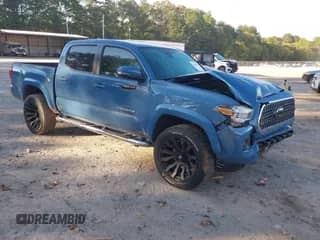 2019 Toyota Tacoma SR5 z VIN 3TMAZ5CN5KM108077, wystawiony jako IAAI lot #43123344 z przebiegiem 64 420 mil mil oraz . Historia ofert i sprzedaży dostępna na DreamBid. Obrazek 1.
