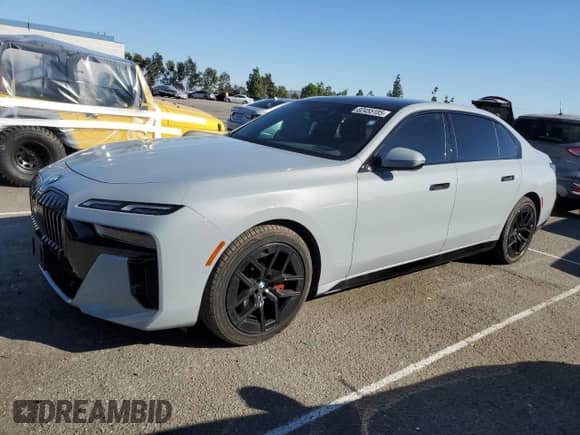 2024 BMW 7 Series 740i with VIN WBA23EH06RCR73037, listed as a Copart auction lot 82455185 with 26,363 mi miles and Salvage title. Bid and sale history available at DreamBid. Image 1.