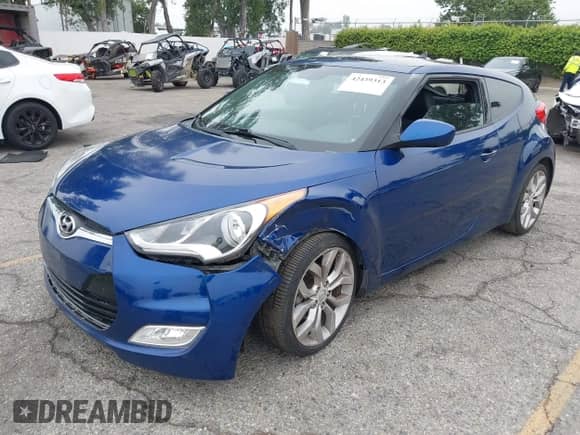 2015 Hyundai Veloster z VIN KMHTC6AD0FU243328, wystawiony jako IAAI lot #42439313 z przebiegiem 96 997 mil mil oraz . Historia ofert i sprzedaży dostępna na DreamBid. Obrazek 18.