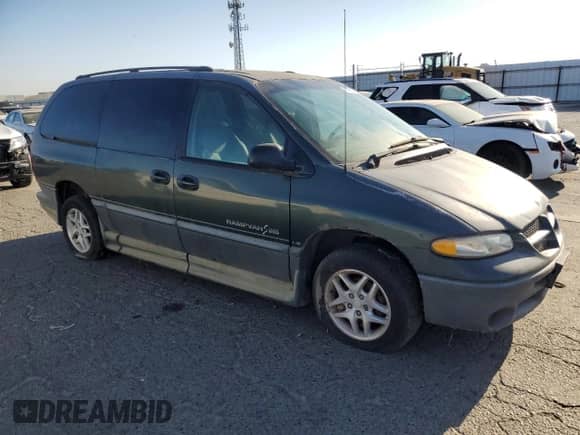 2000 Dodge Caravan LE z VIN 1B4GP54L7YB571056, wystawiony jako Copart lot #71631365 z przebiegiem 136 970 mil mil oraz Szkoda całkowita • Salvage title. Historia ofert i sprzedaży dostępna na DreamBid. Obrazek 4.