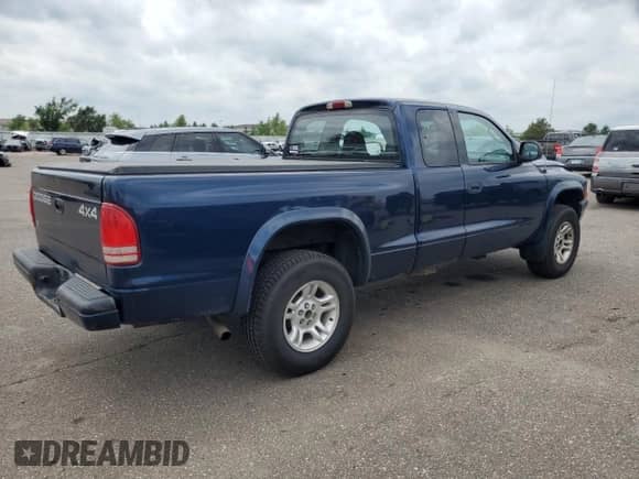 2001 Dodge Dakota Sport z VIN 1B7GG22NX1S348487, wystawiony jako Copart lot #67615205 z przebiegiem 148 733 mil mil oraz Szkoda całkowita • Salvage title. Historia ofert i sprzedaży dostępna na DreamBid. Obrazek 3.