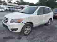 2012 Hyundai Santa Fe GLS z VIN 5XYZGDAB2CG092009, wystawiony jako IAAI lot #43231077 z przebiegiem 163 463 mil mil oraz . Historia ofert i sprzedaży dostępna na DreamBid. Obrazek 2.
