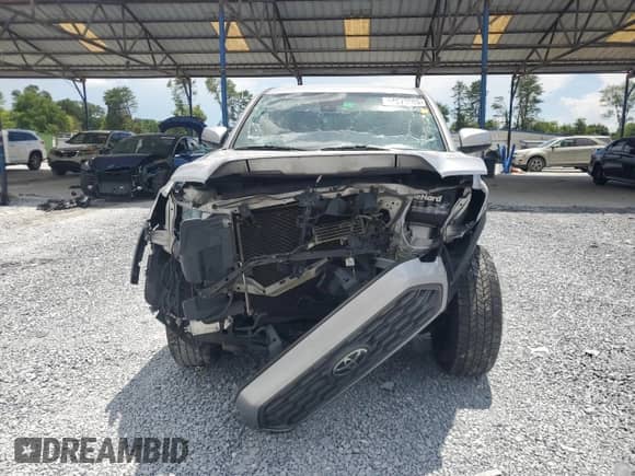 2020 Toyota Tacoma SR5 с VIN 5TFAZ5CN1LX090978, выставлен на аукционе Copart как лот 64010265 с пробегом 117 433 миль миль и Списание • Salvage title. История ставок и продаж доступна на DreamBid. Изображение 5.
