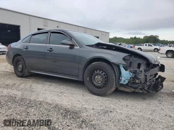 2015 Chevrolet Impala Police Police with VIN 2G1WD5E33F1132870, listed as a Copart auction lot 69433985 with 140,836 mi miles and Salvage title. Bid and sale history available at DreamBid. Image 4.