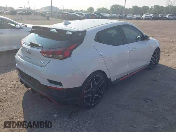 2021 Hyundai Veloster z VIN KMHT36AH7MU010143, wystawiony jako IAAI lot #42407678 z przebiegiem 43 444 mil mil oraz . Historia ofert i sprzedaży dostępna na DreamBid. Obrazek 4.