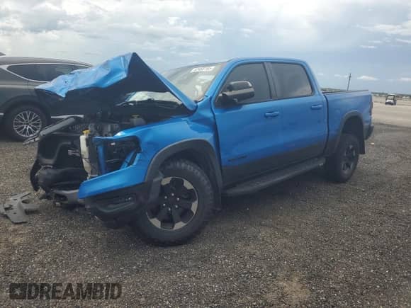 2020 Ram 1500 Rebel z VIN 1C6SRFLT4LN317415, wystawiony jako Copart lot #67455185 z przebiegiem 58 773 mil mil oraz Nie do naprawy • Non repairable. Historia ofert i sprzedaży dostępna na DreamBid. Obrazek 1.