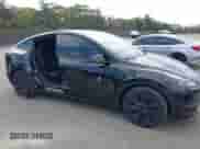 2024 Tesla Model Y with VIN 7SAYGDED8RF156984, listed as a IAAI auction lot 43324819 with 26,941 mi miles and . Bid and sale history available at DreamBid. Image 19.