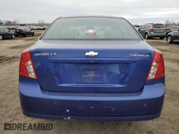 2005 Chevrolet Optra LS с VIN KL1JK59Z85K144184, выставлен на аукционе Copart как лот 48537625 с пробегом 346 711 миль миль и Списание • Salvage title. История ставок и продаж доступна на DreamBid. Изображение 6.