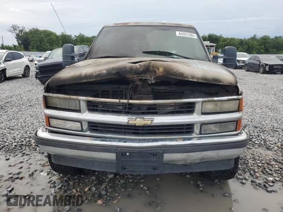 1999 Chevrolet Tahoe with VIN 1GNEC13R0XJ497169, listed as a Copart auction lot 64931085 with Not provided miles and Salvage title. Bid and sale history available at DreamBid. Image 5.