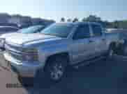 2014 Chevrolet Silverado 1500 LT with VIN 3GCPCREHXEG259073, listed as a IAAI auction lot 43010013 with 128,000 mi miles and . Bid and sale history available at DreamBid. Image 2.
