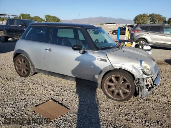 2004 MINI Hardtop with VIN WMWRC33494TC54180, listed as a Copart auction lot 87096995 with 160,028 mi miles and Salvage title. Bid and sale history available at DreamBid. Image 4.