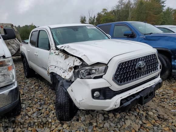2019 Toyota Tacoma TRD Off Road with VIN 3TMCZ5AN8KM217225, listed as a Copart auction lot 71895695 with 80,104 mi miles and Salvage title. Bid and sale history available at DreamBid. Image 4.