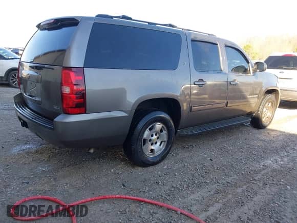2011 Chevrolet Suburban LT z VIN 1GNSCJE09BR344091, wystawiony jako IAAI lot #41605909 z przebiegiem 312 559 mil mil oraz . Historia ofert i sprzedaży dostępna na DreamBid. Obrazek 4.