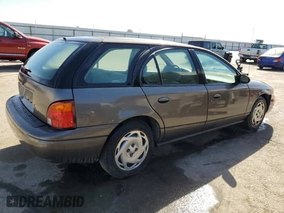 2000 Saturn SW with VIN 1G8ZN827XYZ131326, listed as a Copart auction lot 76143544 with 81,922 mi miles and Salvage title. Bid and sale history available at DreamBid. Image 3.