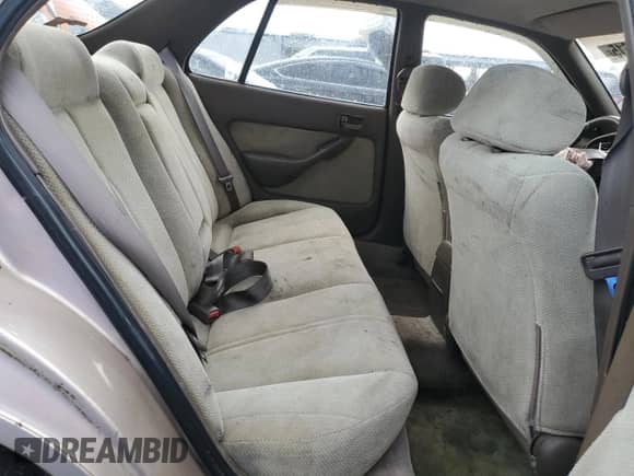 1994 Toyota Camry LE z VIN 4T1SK12E5RU358097, wystawiony jako Copart lot #70173615 z przebiegiem 369 918 mil mil oraz Szkoda całkowita • Salvage title. Historia ofert i sprzedaży dostępna na DreamBid. Obrazek 10.