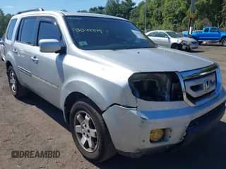 2009 Honda Pilot Touring with VIN 5FNYF48929B043779, listed as a IAAI auction lot 43044349 with 197,551 mi miles and . Bid and sale history available at DreamBid. Image 1.