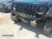 2022 Jeep Wrangler Unlimited Rubicon with VIN 1C4JJXR62NW173198, listed as a IAAI auction lot 42564940 with 57,001 mi miles and . Bid and sale history available at DreamBid. Image 6.