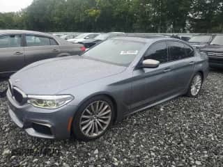 2018 BMW 5 Series M550i xDrive with VIN WBAJB9C50JB036915, listed as a Copart auction lot 69015695 with 85,269 mi miles and Salvage title. Bid and sale history available at DreamBid. Image 1.