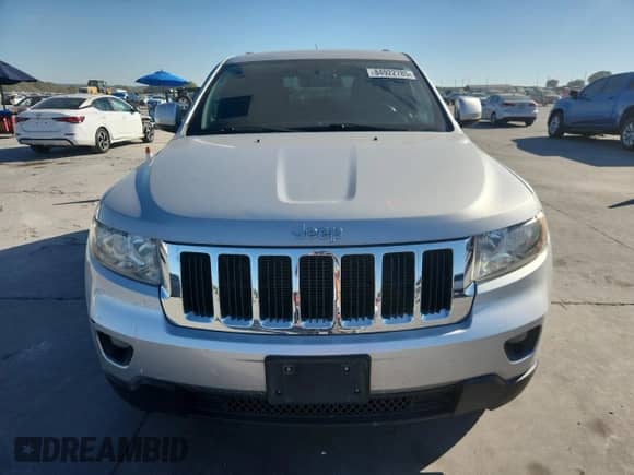 2012 Jeep Grand Cherokee Laredo z VIN 1C4RJEAG4CC334306, wystawiony jako Copart lot #84922785 z przebiegiem 185 339 mil mil oraz Szkoda całkowita • Salvage title. Historia ofert i sprzedaży dostępna na DreamBid. Obrazek 5.