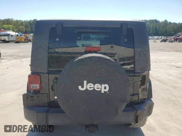 2007 Jeep Wrangler Unlimited Sahara z VIN 1J4GA59127L152918, wystawiony jako Copart lot #85123165 z przebiegiem 180 573 mil mil oraz Szkoda całkowita • Salvage title. Historia ofert i sprzedaży dostępna na DreamBid. Obrazek 6.