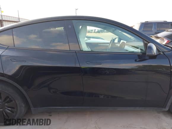 2023 Tesla Model Y Long Range z VIN 7SAYGAEE7PF767951, wystawiony jako IAAI lot #43128878 z przebiegiem 36 431 mil mil oraz . Historia ofert i sprzedaży dostępna na DreamBid. Obrazek 13.