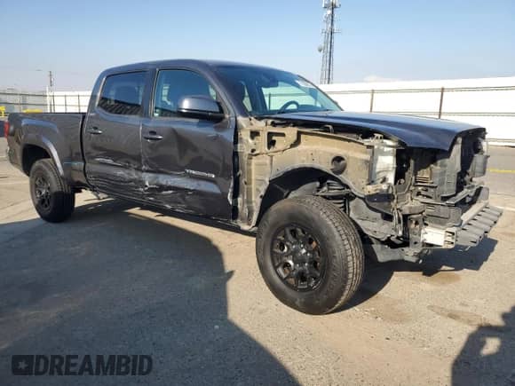 2019 Toyota Tacoma SR5 with VIN 3TMBZ5DN5KM019662, listed as a Copart auction lot 71650075 with 105,601 mi miles and Salvage title. Bid and sale history available at DreamBid. Image 4.