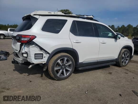 2023 Honda Pilot Touring с VIN 5FNYG2H71PB002492, выставлен на аукционе Copart как лот 41790915 с пробегом 18 450 миль миль и Списание • Salvage title. История ставок и продаж доступна на DreamBid. Изображение 3.